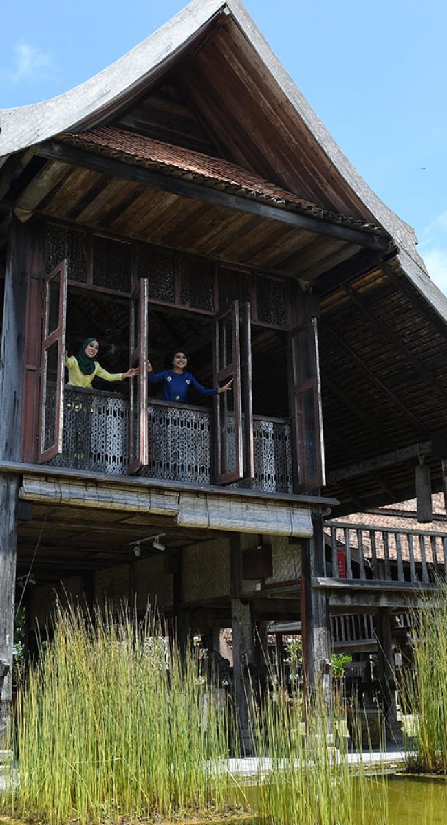 Parit Jawa, Johor, Malaysia - 6 July 2016, Happy children enjoying the Hari Raya Balik Kampung celebration after the fasting month Ramadan at a traditional Malay kampung house.